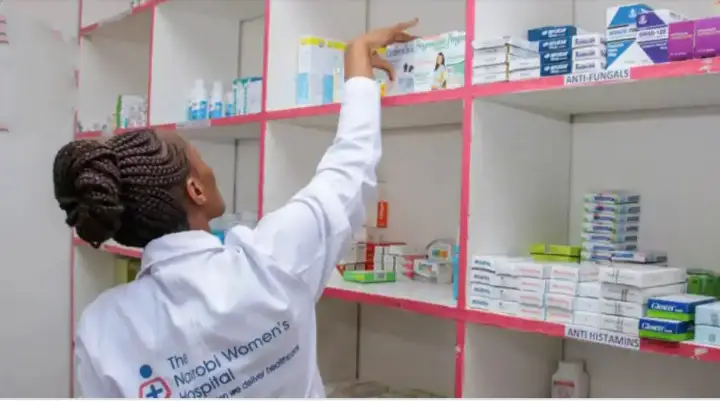 Pharmacist arranging drugs